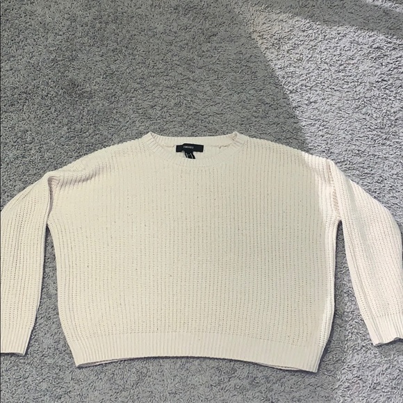 A white knitted sweater. - Picture 1 of 2